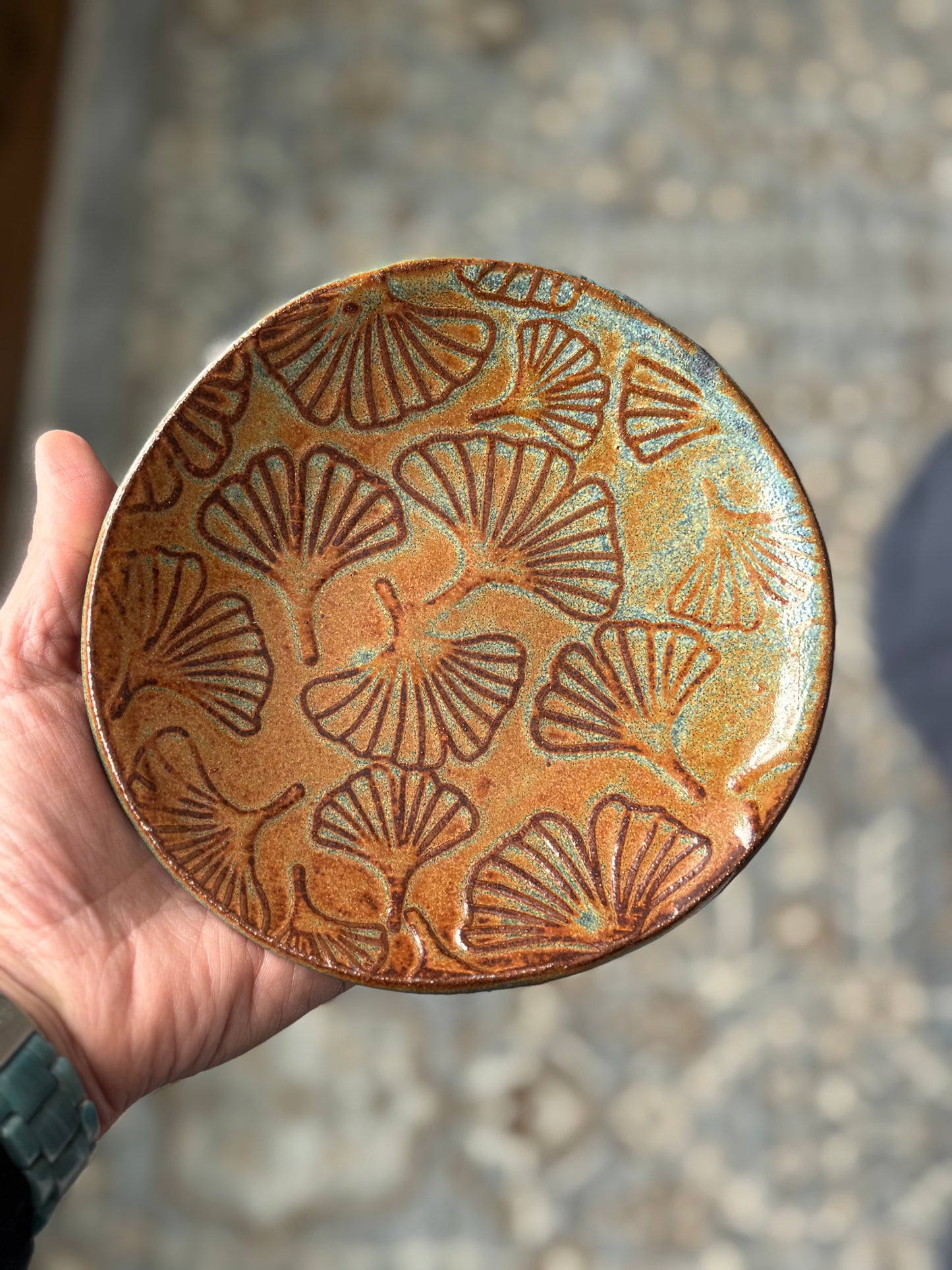 Handbuilt organic round ceramic dish with ginkgo leaf texture, finished in earth tones including orange, blue, and green glaze – artisan pottery dish by Mountain Sky Pottery – handmade textured tray, nature-inspired home décor, rustic ceramic catchall